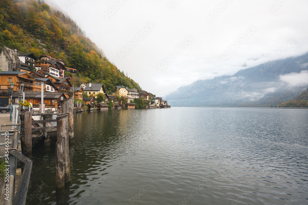 Beautiful Hallstatt Village in Austria during Fall with Cloudy Skies and a Calm Lake