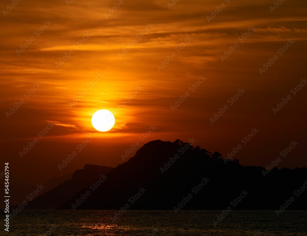 Naklejka premium Beautiful dramatic scenery of vibrant sunset in the sky on Lopud Island, Croatia