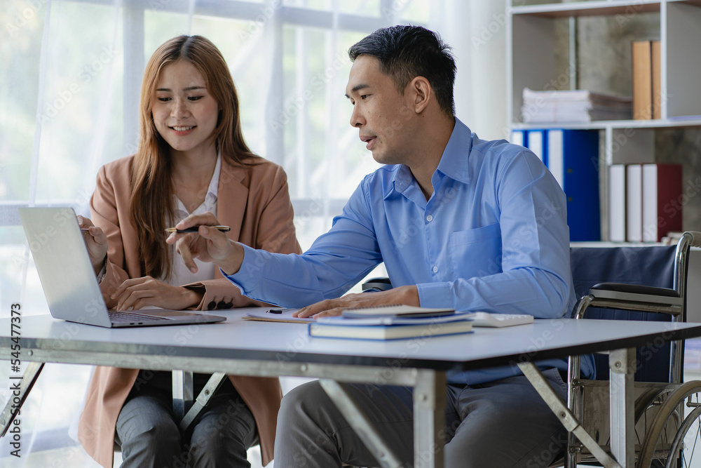 Fototapeta premium Asian male businessman and female accountant meeting financial budget, financial graph analysis with laptop, calculate with calculator in office.