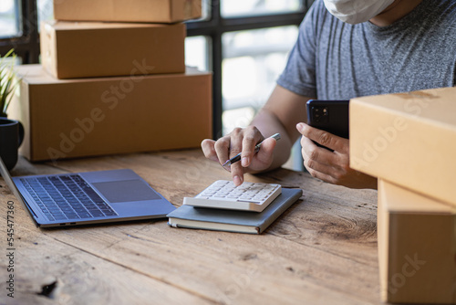 SME Business Entrepreneur Working From Home With Parcel Boxes And Laptop Taking Orders And Shipping Online Grocery Business Ideas