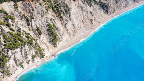 Aerial drone photo of famous paradise beach of Egremni white steep rocky hills overlooking deep turquoise Ionian sea  Lefkada island