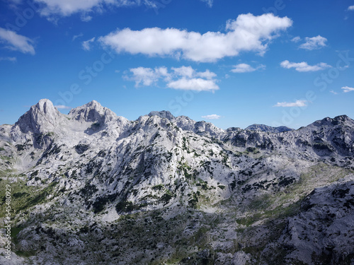 Aerial drone view of different mountain peaks during a beautiful sunny day with a green valley below. Connection with nature, More adventure in life. Prenj Mountain in Bosnia and Herzegovina. 