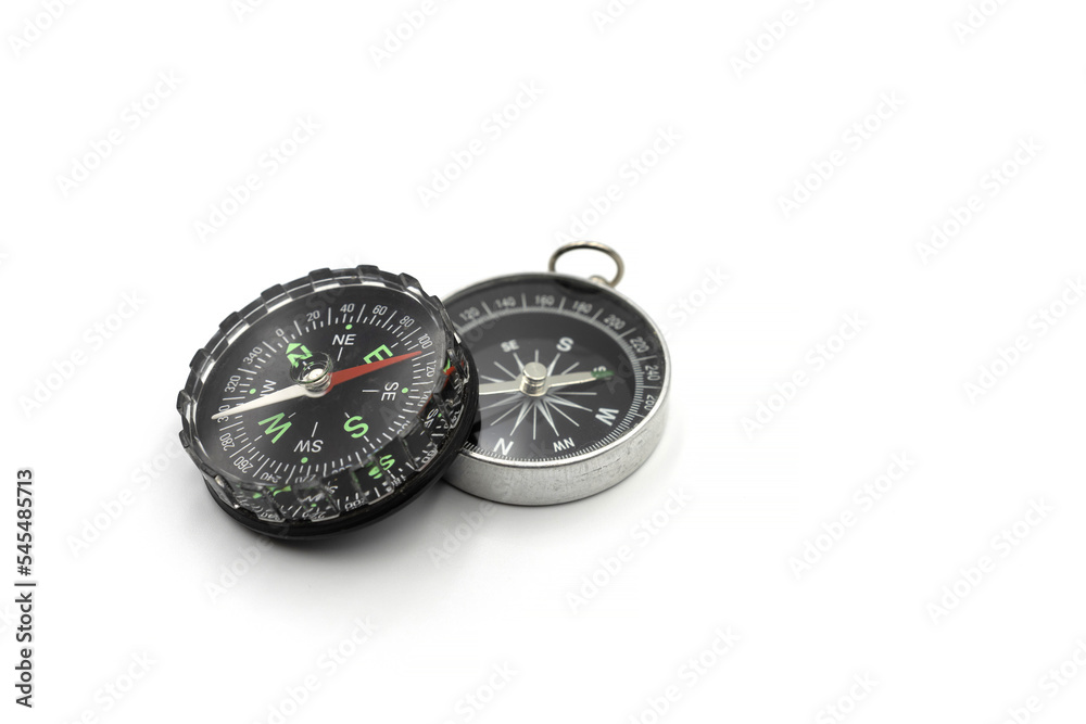 Compass with a black dial isolate on a white background. Traditional navigation device indicating the cardinal points. Compass with a black dial isolate on a white background. Traditional navigation device indicating the cardinal points.