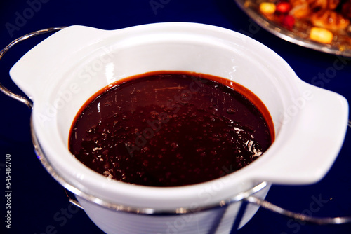 Sweet red berry jam or confiture in a bowl isolated