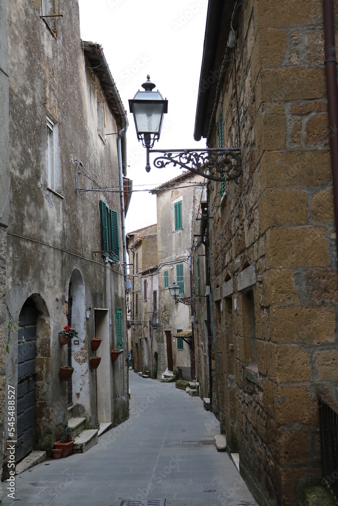 Old narrow alley in Pitigliano, Tuscany Italy
