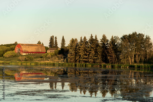 slough by farm, Saskatchewan