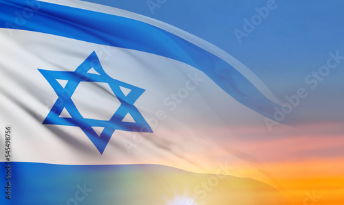 National flag of Israel on background of a sunset or sunrise. National Holidays background photo