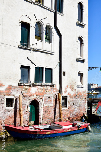 Venice, Italy. Boat in canal near old building in Venice