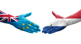 Handshake between Tuvalu and Netherlands flags painted on hands, isolated transparent image.