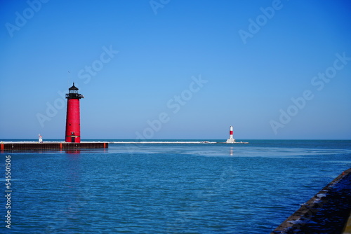 Kenosha North Pier lighthouse standing during the cold Winter Season of February out in Kenosha, Wisconsin onto Lake Michigan