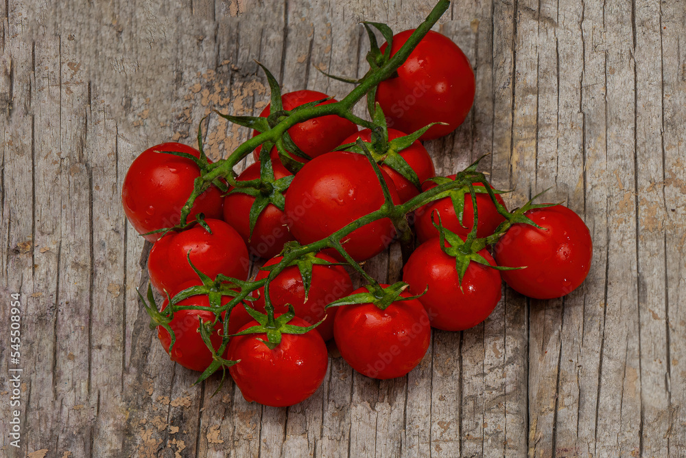 bunch of red tomatoes on an old board bunch of red tomatoes on an old board