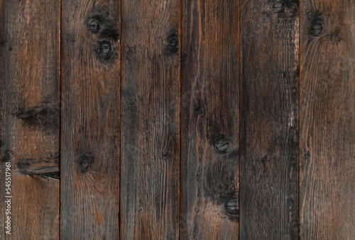 Dark brown wooden planks, texture. Grunge wood background.