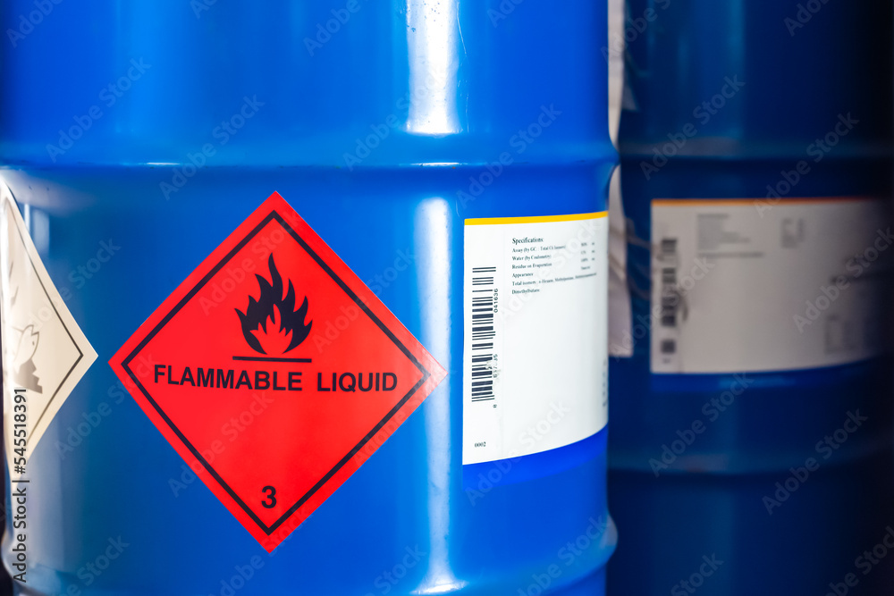 Label of flammable liquid, hazardous chemical warning symbol on the chemical barrel show caution for use, dimethylbutane, methanol, ethanol, butanol. Industrial use and scientific research. - obrazy, fototapety, plakaty 