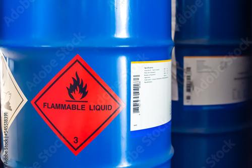 Label of flammable liquid, hazardous chemical warning symbol on the chemical barrel show caution for use, dimethylbutane, methanol, ethanol, butanol. Industrial use and scientific research.