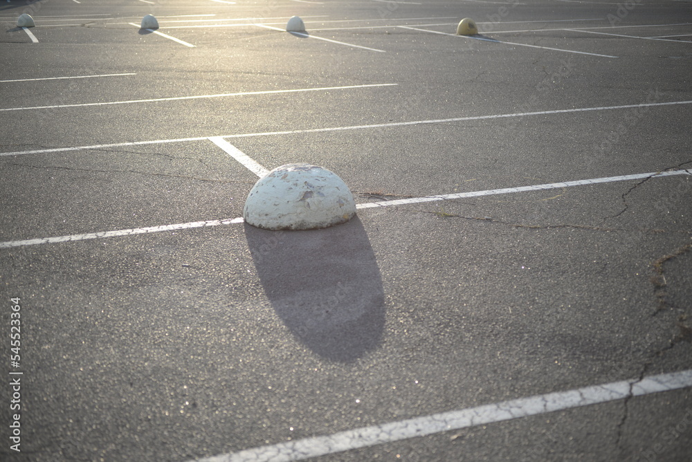concrete traffic limiters concrete markers painted white, parking space