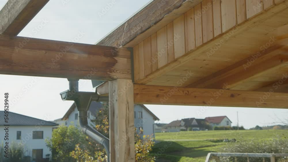 wooden sunshade construction and roof gutter on home terrace wooden sunshade construction and roof gutter on home terrace