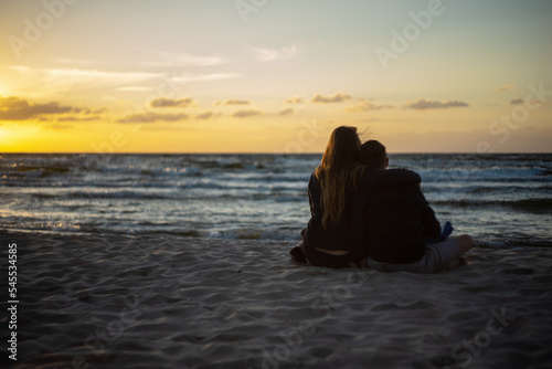 person on the beach at sunset