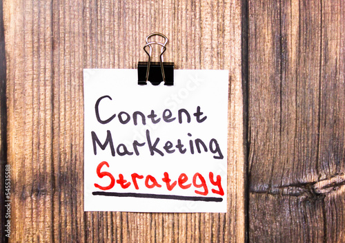 Content marketing strategy - text concept on a piece of paper on the table.