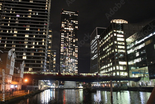 City skyline with train and water at night © CG