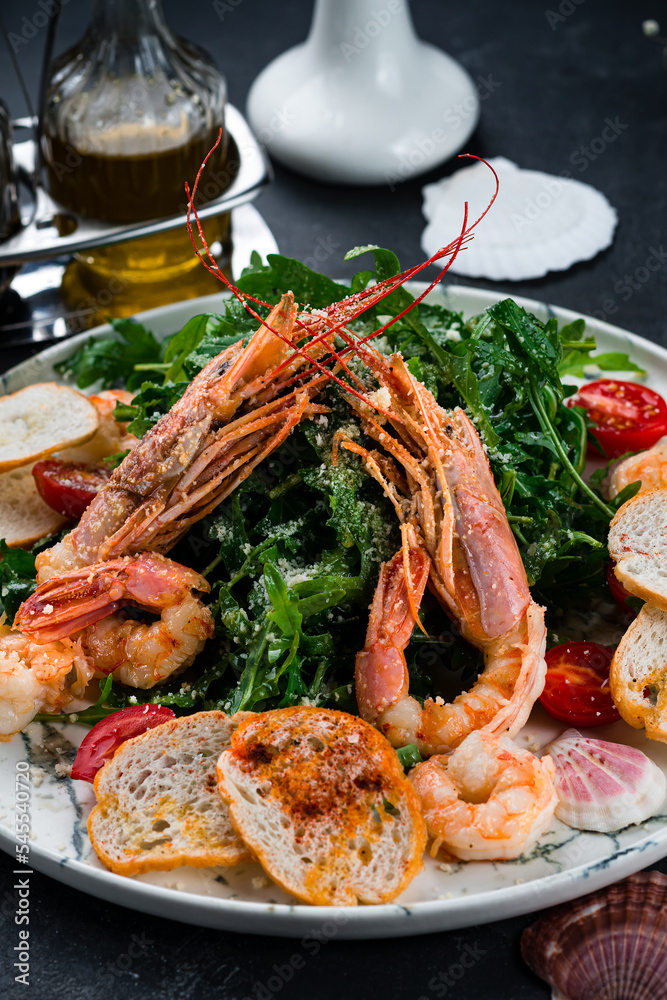 Salad with grilled giant langoustine shrimp, prawns and arugula Salad with grilled giant langoustine shrimp, prawns and arugula