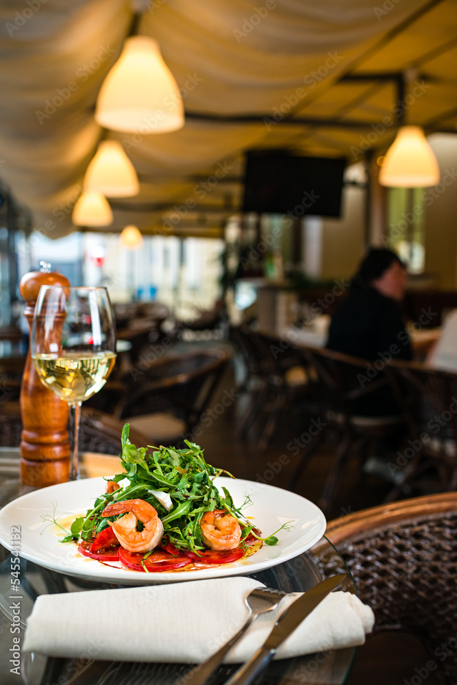salad with shrimp and white wine in the restaurant salad with shrimp and white wine in the restaurant