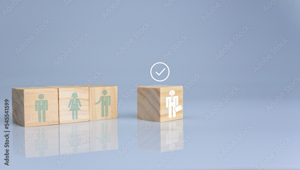 Concept of Business and HR for leadership and team leader. One cube wood block out in front Different and stand out from the group Concept of Business and HR for leadership and team leader. One cube wood block out in front Different and stand out from the group