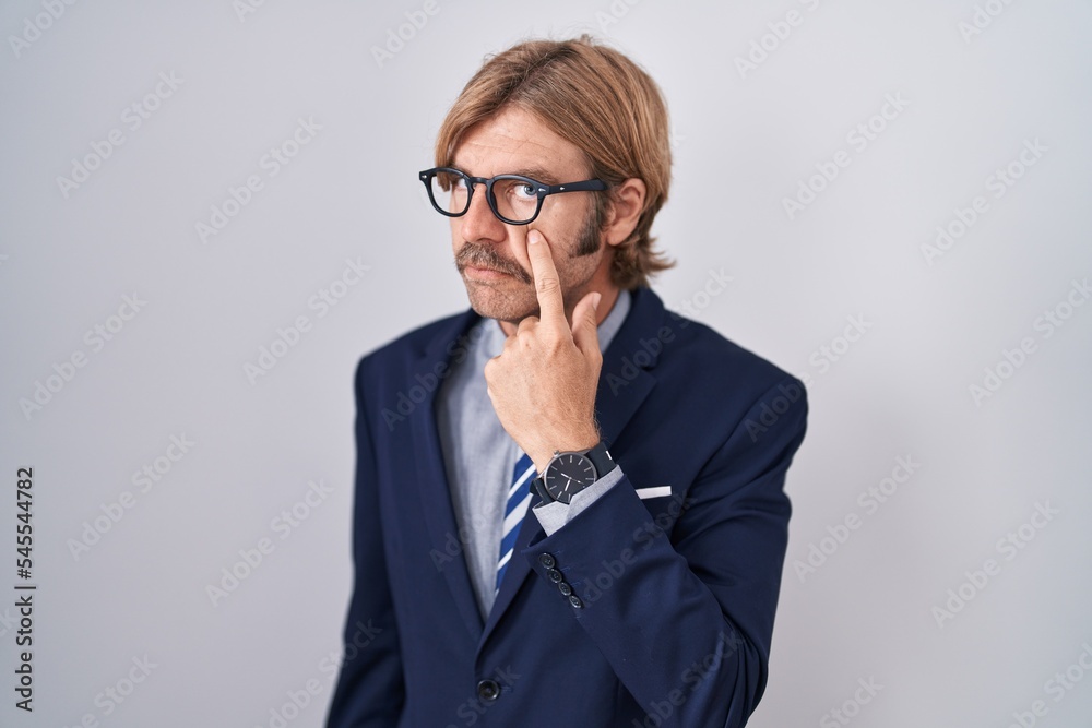 Caucasian man with mustache wearing business clothes pointing to the eye watching you gesture, suspicious expression Caucasian man with mustache wearing business clothes pointing to the eye watching you gesture, suspicious expression