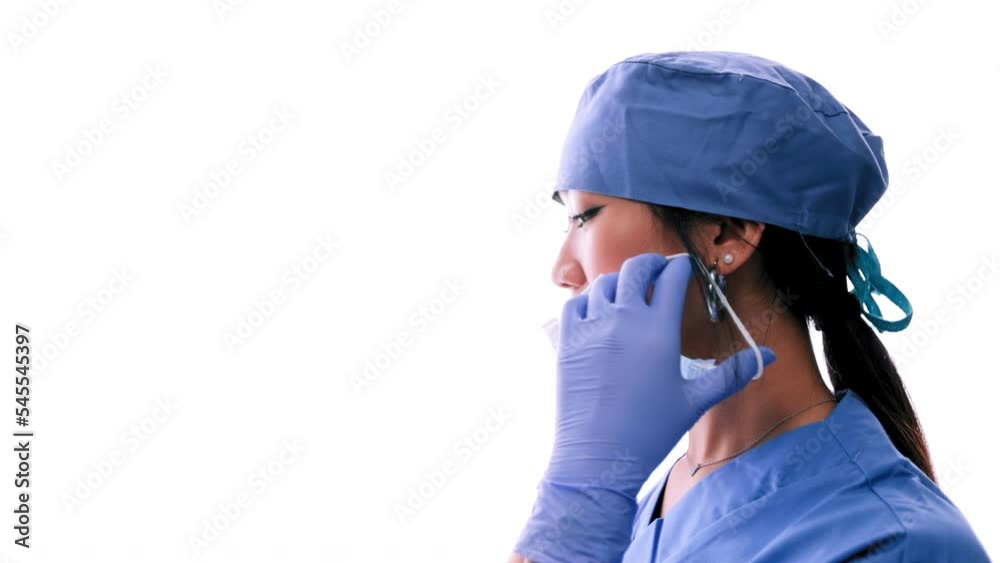 An Asian doctor wearing a mask.