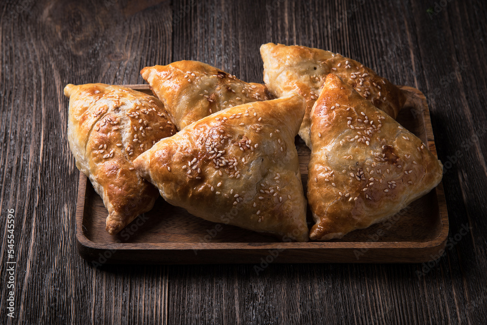 Samsa, pie with minced meat. Uzbek national dish. Samsa, pie with minced meat. Uzbek national dish.