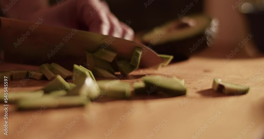 Crop woman slicing fresh avocado Crop woman slicing fresh avocado