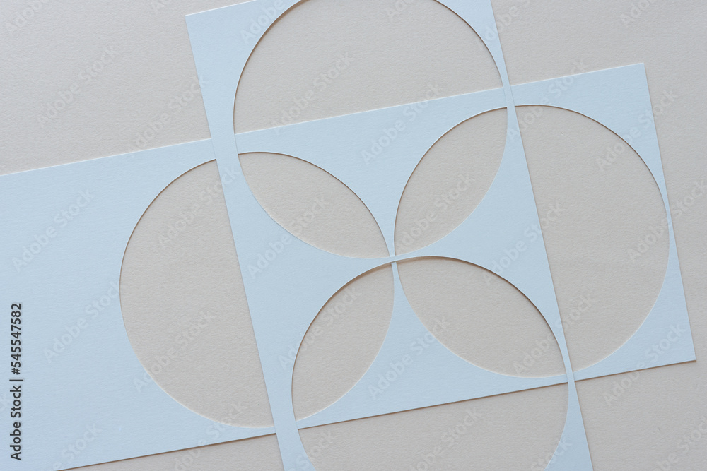 paper stencils with circle shape cutouts overlapping Stock Photo