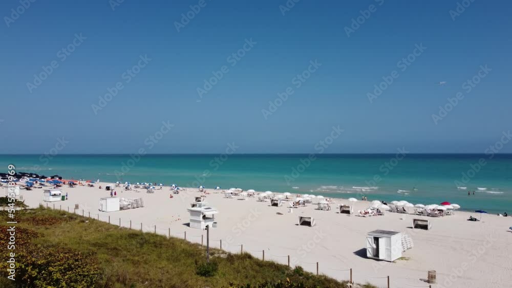 White sandy beaches of Miami Beach on a sunny day - aerial view White sandy beaches of Miami Beach on a sunny day - aerial view