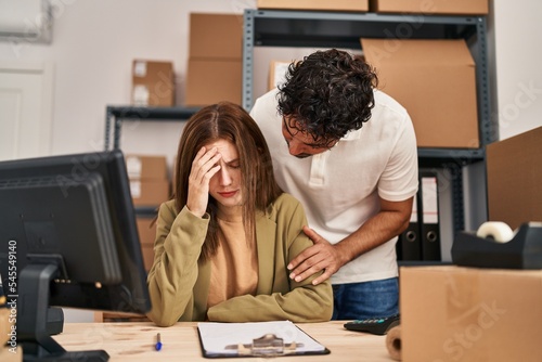 Man and woman business workers with sad expression working at office