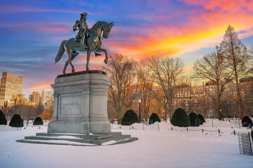 Sunset over George Washington statue in Boston public garden at winter
