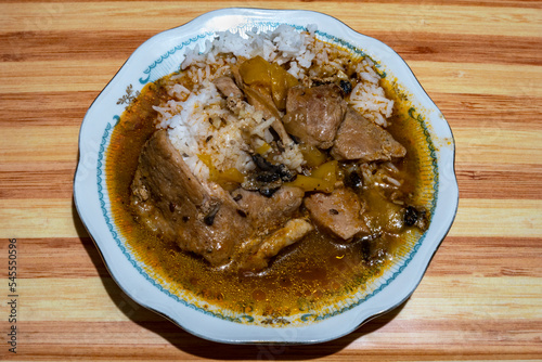 Stewed pork with mushrooms and rice on juice