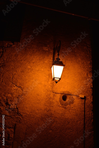 Closeup of a street lamp at night in a deserted street