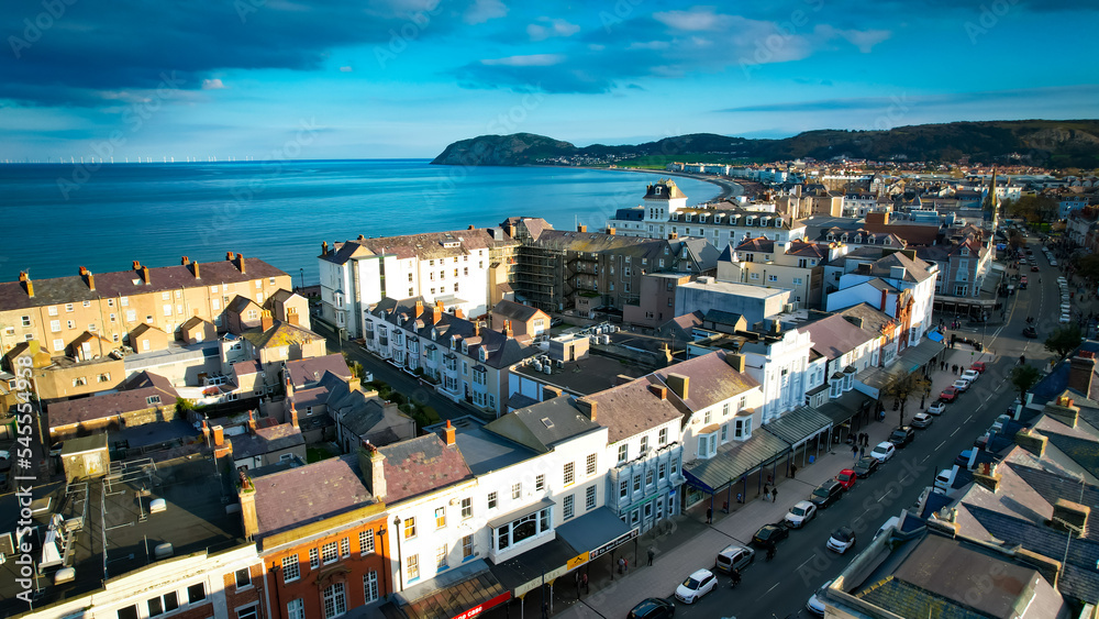 Obraz premium Llandudno, Wales. Aerial view over the seaside town with Victorian Pier and Irish Sea shore.