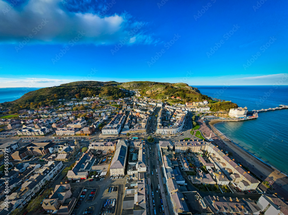 Llandudno, Wales. Aerial view over the seaside town with Victorian Pier and Irish Sea shore.