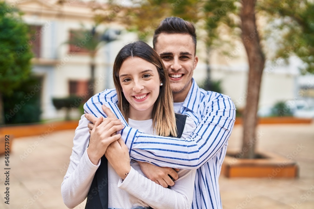Man and woman couple smiling confident hugging each other at park Man and woman couple smiling confident hugging each other at park