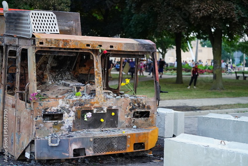 Damaged burned garbage trucks in the streets from rioters of Jacob Blake protest. photo