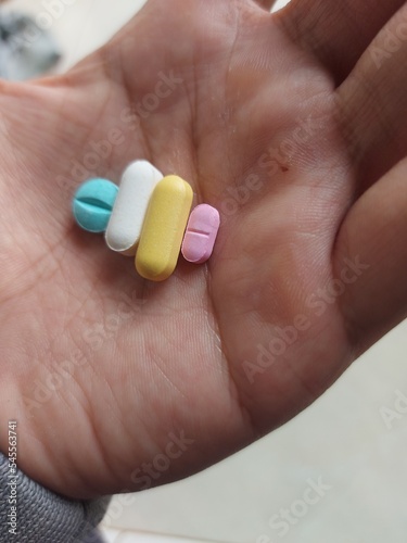 A Men hold  Pills in his hand. drags and medecine concept, Medecine Capsules , pill, health, prescription