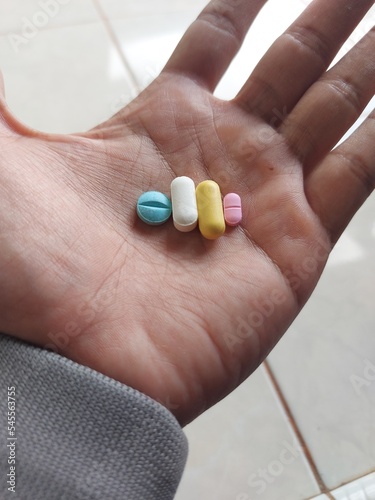 A Men hold  Pills in his hand. drags and medecine concept, Medecine Capsules , pill, health, prescription