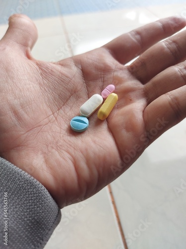 A Men hold  Pills in his hand. drags and medecine concept, Medecine Capsules , pill, health, prescription