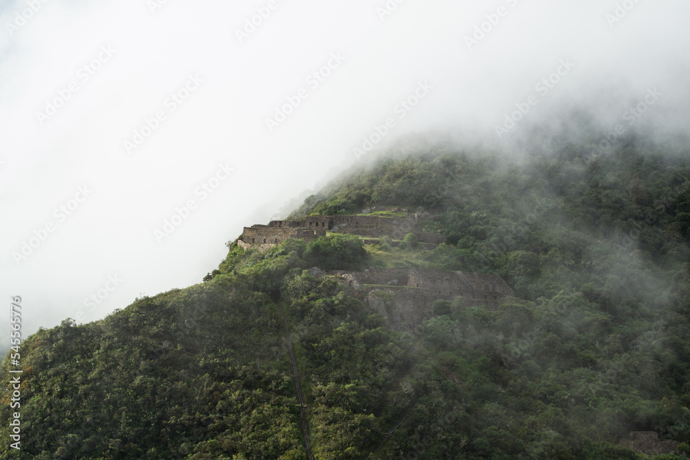 Choquequirao in the clouds in the Peruvian mountains
