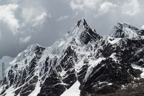 Black and white glaciated mountain in the andes photo