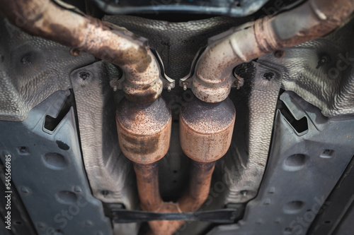 Close-up of catalytic converter in car exhaust system.