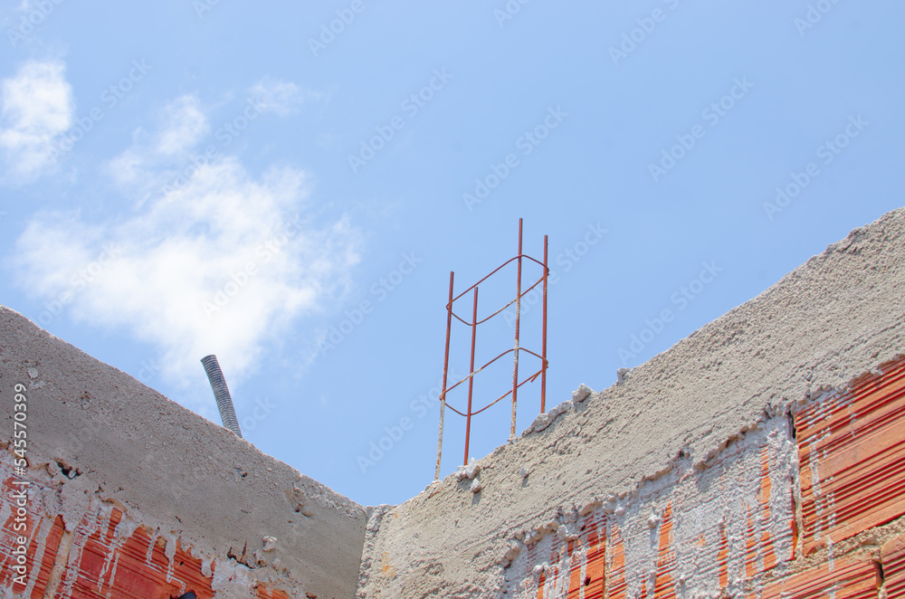 Brick wall under construction of brazilian house, brick under construction in brazil. blocks or bricks (masonry) of red clay on a wall, in the work of Brazilians. Brick wall under construction of brazilian house, brick under construction in brazil. blocks or bricks (masonry) of red clay on a wall, in the work of Brazilians.