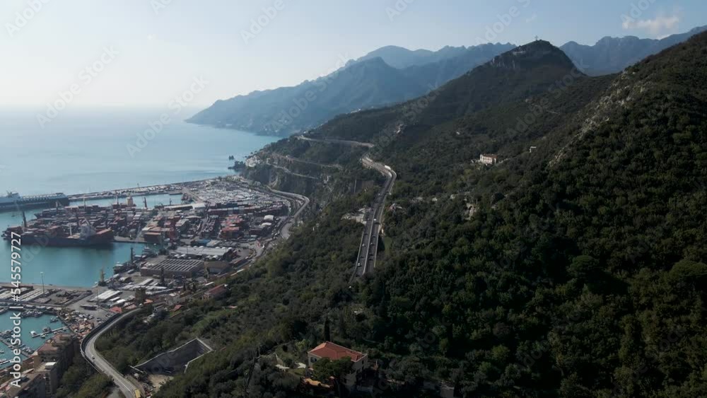 Aerial view of the highway along the coastline with mountains in Salerno, Campania, Italy.