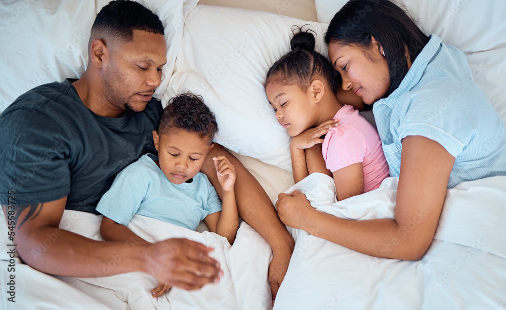 Family, sleeping and in bed together, love and care with parents and children at family home. Mother, father and kids rest, relax and sleep comfortable in bedroom with cuddle and bonding. Family, sleeping and in bed together, love and care with parents and children at family home. Mother, father and kids rest, relax and sleep comfortable in bedroom with cuddle and bonding.