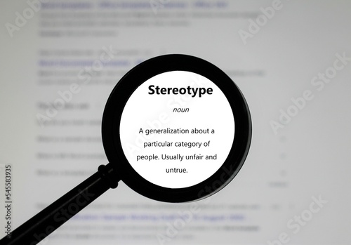 Selective focus on word Stereotype, word in a dictionary. Close up of an English dictionary page with word stereotype.